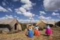 Puno Lake Titicaca with Totoras Island with women from the Uros culture with their typical clothes and straw hats