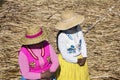 Lake Titicaca with Totoras Island with women from the Uros culture with their typical clothes and straw hats