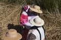 Puno Lake Titicaca with Totoras Island with women from the Uros culture with their typical clothes and straw hats