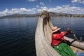 Puno Peru Lake Titicaca with Totoras Island with women from the Uros culture with their typical clothes and straw hats