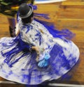 Puno woman dancing with her typical colorful clothes during a musical show at La Vigen de la Candelaria carnival