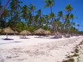 Punta Cana, Dominican Republic. Sea, beach umbrellas, peace, vacation, palm trees and relax Royalty Free Stock Photo