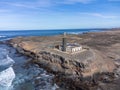 Punta de Jandia and lighthouse on southern end of Fuerteventura island, accessible only by gravel road Royalty Free Stock Photo
