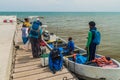 PUNTA GORDA, BELIZE - MARCH 9, 2016: Passengers boarding a boat to Livingston Guatemala in a port of Punta Gorda town