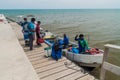 PUNTA GORDA, BELIZE - MARCH 9, 2016: Passengers boarding a boat to Livingston Guatemala in a port of Punta Gorda town