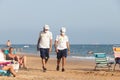 Punta Umbria, Huelva, Spain - August 7, 2020: Beach safety guard of Junta de Andalucia is controlling the social distancing and