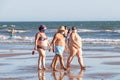 Punta Umbria, Huelva, Spain - August 2, 2020: People with overweight walking by the beach wearing protective or medical face masks