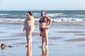Punta Umbria, Huelva, Spain - August 2, 2020: two overweight women at the beach wearing protective or medical face masks. New