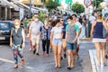 Punta Umbria, Huelva, Spain - July 3, 2020: People walking by calle Ancha street wearing protective mask due to covid-19