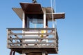 Punta Umbria, Huelva, Spain - July 9, 2020: A woman lifeguard on surveillance tower in Punta Umbria beach, Huelva, Spain