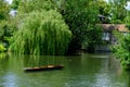 A punting boat drifts by itself on River Cam in Cambridge, England Royalty Free Stock Photo