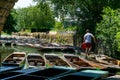 Punting boats by Magdalen Bridge Boathouse on river Cherwell in Oxford, many boats docked together in rows. Bright and colorfull Royalty Free Stock Photo