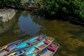 Punting boats by Magdalen Bridge Boathouse on river Cherwell in Oxford, many boats docked together in rows. Bright and colorfull Royalty Free Stock Photo