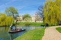 Punting on river Cam on a sunny day, Cambridge, UK