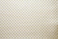 Artificial fabric texture punto 19659 golden color dotted Royalty Free Stock Photo