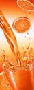 Puor of orange juice falling into a glass. Royalty Free Stock Photo