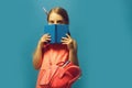 Pupil with braids,  on blue background Royalty Free Stock Photo