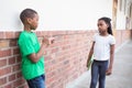 Pupil bullying another in the hall Royalty Free Stock Photo