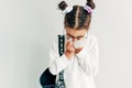 A pupil child girl sneezing the nose and cold cough on tissue paper because weak or virus and bacteria from dust weather. Little