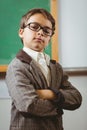 Pupil dressed up as teacher with arms crossed Royalty Free Stock Photo