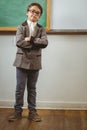 Pupil dressed up as teacher with arms crossed Royalty Free Stock Photo