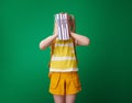 Pupil holding schoolbooks in front of face Royalty Free Stock Photo