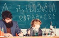 Pupil kid in the chemistry class father and son at school. Science chemistry concept. confidence charisma. Back to