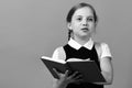 Pupil in school uniform with braid. Girl with happy face Royalty Free Stock Photo