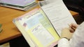 Pupil with schoolbook of french language