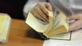 Pupil with schoolbook of french language