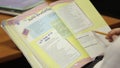 Pupil with schoolbook of french language