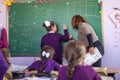 Pupil works with the board in the classroom
