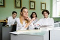 Pupils at biology lesson at school with animal cell models on the table. Biology teacher gives a lesson to Royalty Free Stock Photo