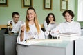 Pupils at biology lesson at school with animal cell models on the table. Biology teacher gives a lesson to Royalty Free Stock Photo