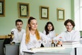 Pupils at biology lesson at school with animal cell models on the table. Biology teacher gives a lesson to Royalty Free Stock Photo