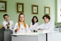 Pupils at biology lesson at school with animal cell models on the table. Biology teacher gives a lesson to Royalty Free Stock Photo