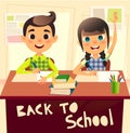 Pupils during classroom at the elementary school. Schoolgirl raising her hand. Schoolboy writes in notebook. Children at the desk Royalty Free Stock Photo