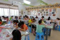 Pupils on handicraft course of chinese paper-cut