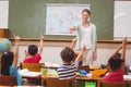 Pupils raising hand in classroom