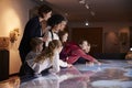 Pupils On School Field Trip To Museum Looking At Map Royalty Free Stock Photo