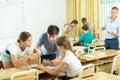 Pupils sitting in class by groups