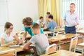 Pupils sitting in class by groups