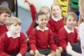 Pupils Sitting On Mat Listening To Teacher Royalty Free Stock Photo