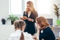 Pupils and teacher reading book in classroom Royalty Free Stock Photo