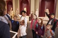 Pupils And Teacher On School Field Trip To Museum With Guide Royalty Free Stock Photo