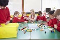 Pupils And Teacher Working With Coloured Blocks Royalty Free Stock Photo