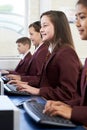 Pupils Wearing School Uniform In Computer Class Royalty Free Stock Photo