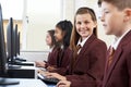 Pupils Wearing School Uniform In Computer Class Royalty Free Stock Photo