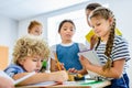 pupils writing off homework of their classmate