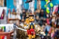 Puppets of Pinocchio hanging from a toy stand Royalty Free Stock Photo